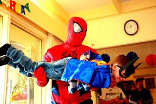 Spiderman with birthday boy on party day